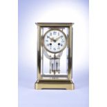 A brass cased, 4 glass clock by ‘Marti et cie’