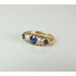 An Edwardian 18ct gold graduated five stone sapphire and diamond ring