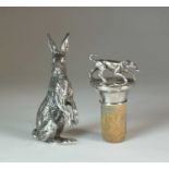 An Elizabeth II silver model of a hare and a white metal topped cork