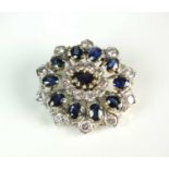 A sapphire and diamond oval cluster brooch