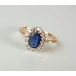 A kyanite and diamond oval cluster ring