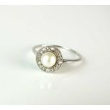 A untested pearl and diamond cluster ring