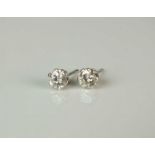 A pair of diamond stud earrings