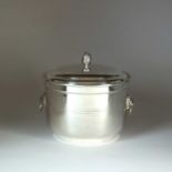 A silver ice bucket/wine cooler