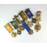 A collection of silver, silver gilt and polychrome enamel Masonic badges
