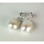 A pair of baroque pearl and diamond earrings