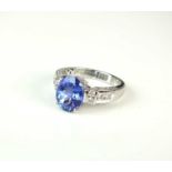 An 18ct white gold tanzanite and diamond ring