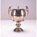 A three handled silver cup