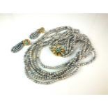 A multi-strand cultured pearl necklace with 18ct gold diamond and turquoise clasp and earrings