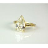 An 18ct gold single stone pear shaped diamond ring