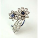 A sapphire and diamond floral spray brooch