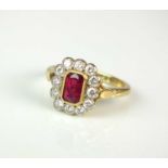 An 18ct gold ruby and diamond cluster ring