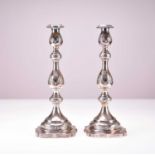 A pair of George V silver candlesticks