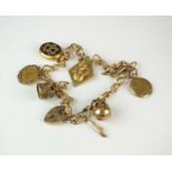 An 18ct gold curb link chain with attached charms