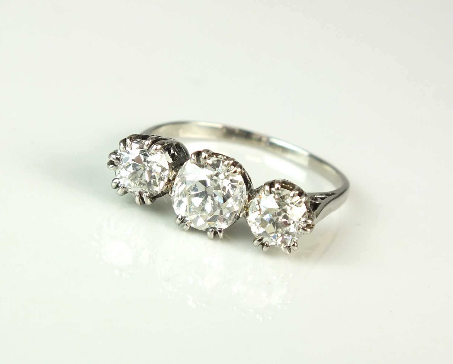 A graduated three stone diamond ring