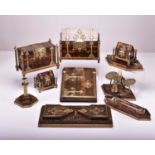 A fine and unusual Gothic revival brass-bound coromandel nine-piece desk set