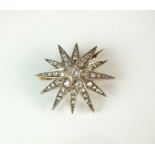 A late 19th century diamond set star burst brooch/pendant