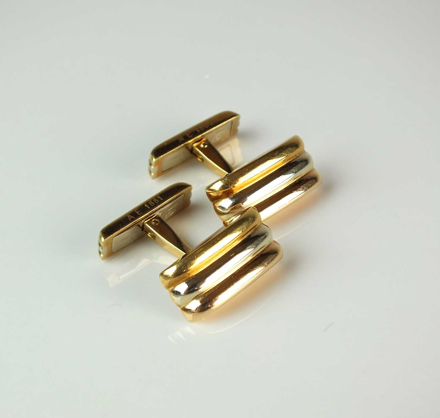 A pair of Cartier 18ct tri-coloured gold cufflinks