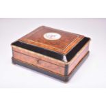 A French parcel ebonised amboyna and rosewood, gilt metal and porcelain mounted jewel box