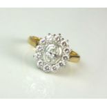 An 18ct gold oval diamond cluster ring