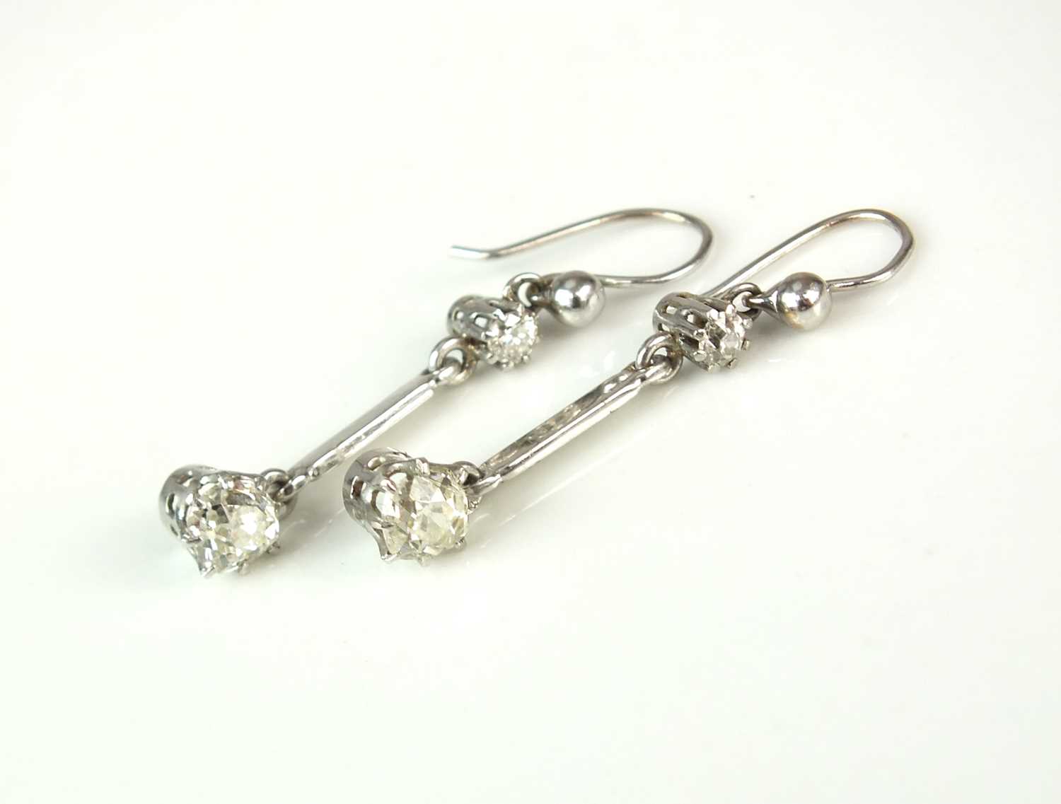 A pair of diamond ear pendants