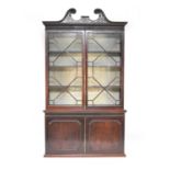 A 19th century mahogany glazed bookcase cabinet