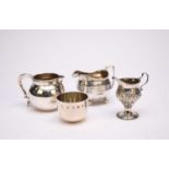 Three silver jugs and a silver tumbler cup