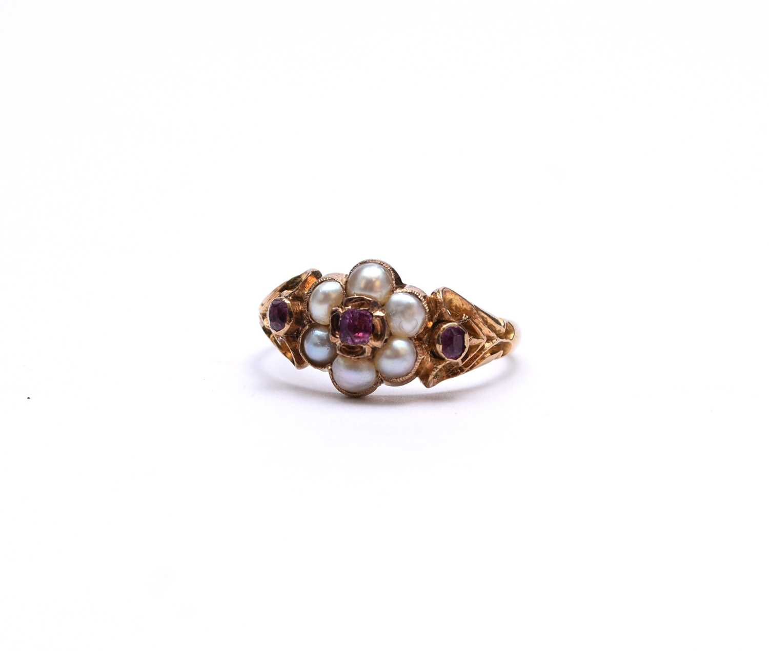 A late 19th/early 20th century pink sapphire and pearl floral cluster ring