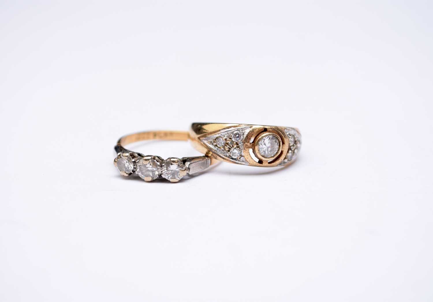 A graduated three stone diamond ring and a 9ct gold paste ring