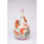 A large Chinese famille rose relief moulded bottle vase