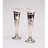 A pair of Edwardian silver mounted vases