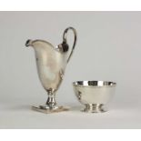 A silver cream jug and a sugar bowl