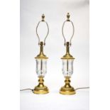 A pair of lacquered brass and cut glass table lamps