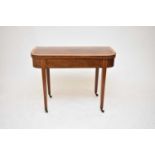 A George III inlaid mahogany fold-over tea table