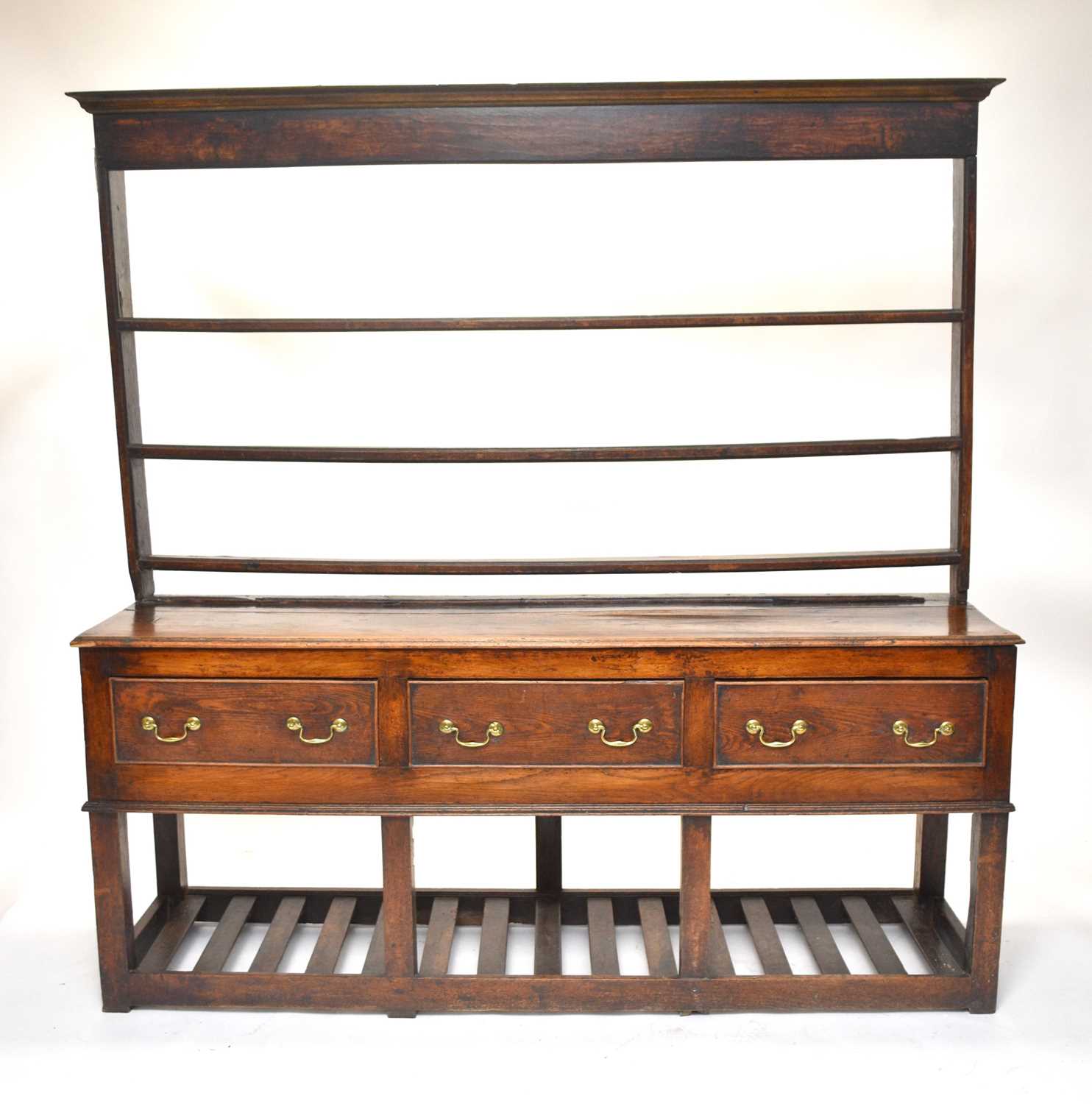 A George III oak dresser and rack