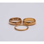 Three gold wedding bands