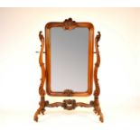 A 19th century Austrian, Rococo style, walnut cheval mirror