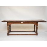 An oak and fruitwood refectory dining table