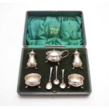 A cased silver cruet set