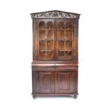 An 18th century style Dutch-colonial hard-wood bookcase cabinet