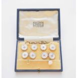 A cased set of enamel and mother of pearl cufflinks and studs