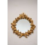 A giltwood oval wall mirror