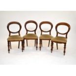 A set of twelve mahogany balloon back dining chairs