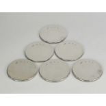 A set of six silver mounted coasters