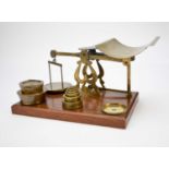 A late Victorian/Edwardian set of brass counter-top scales