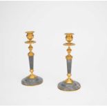 A pair of gilt-metal and grey-veined marble candlesticks