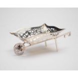 A silver model of a wheelbarrow