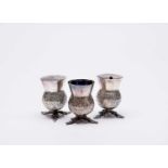 A three piece silver plated 'thistle' cruet set