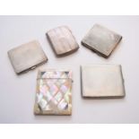 A collection of four silver cigarette cases and a mother of pearl card case