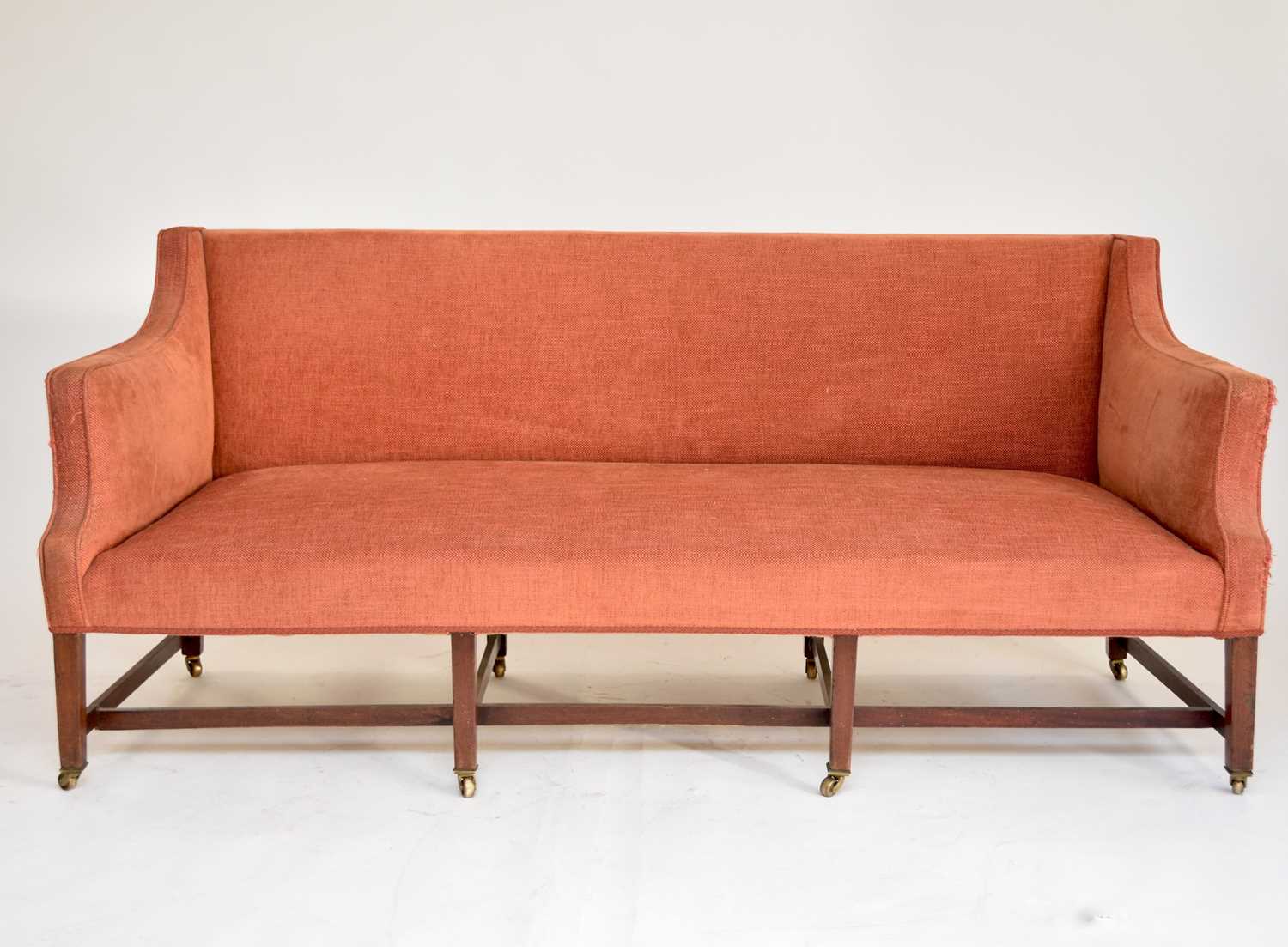A George III upholstered mahogany settee